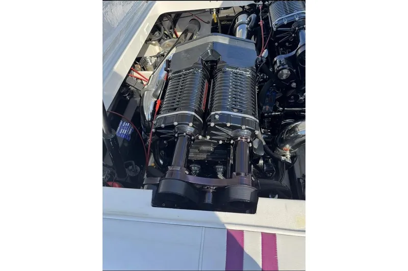 Slide: The Image of Engine of a 1997 Fountain 42 Lightning boat, showcasing detailed mechanical components. - 10