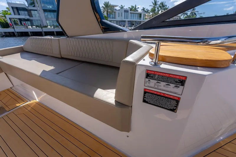 Slide: The Image of Luxurious seating area on a 2026 Hanover 347 yacht with modern design and safety notices. - 12