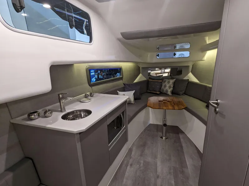 Slide: The Image of 2025 Hanover 347 Inboard yacht interior with modern kitchen and cozy seating area. - 21