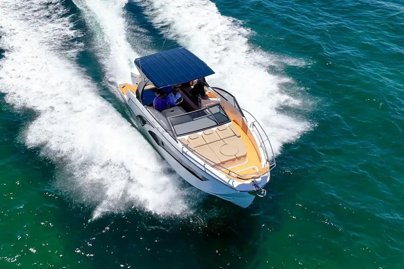 Slide: The Image of 2026 Hanover 347 boat cruising on clear blue water. - 3