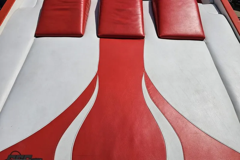 Slide: The Image of Red and white upholstery on 1995 Hustler 40 Fiore boat, featuring sleek design. - 21