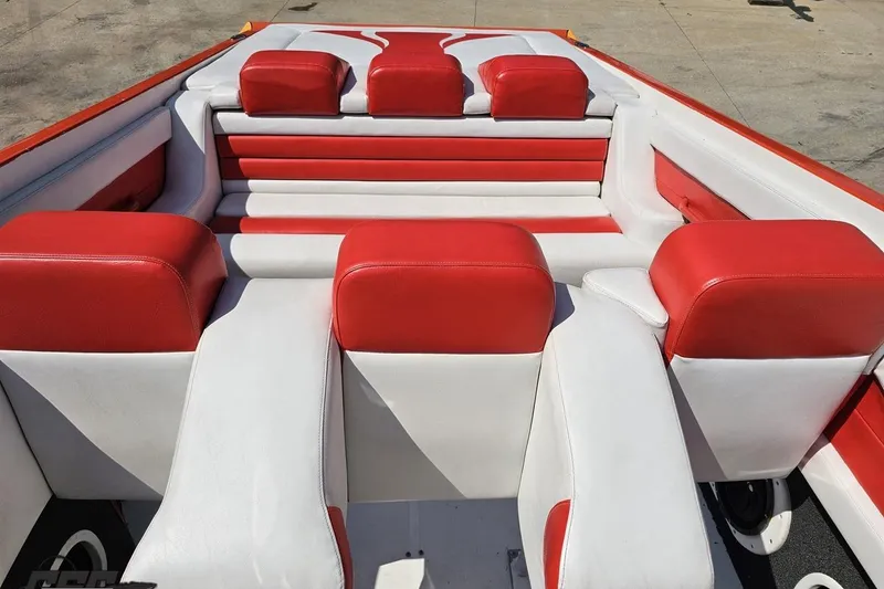 Slide: The Image of 1995 Hustler 40 Fiore boat interior with red and white seating. - 40