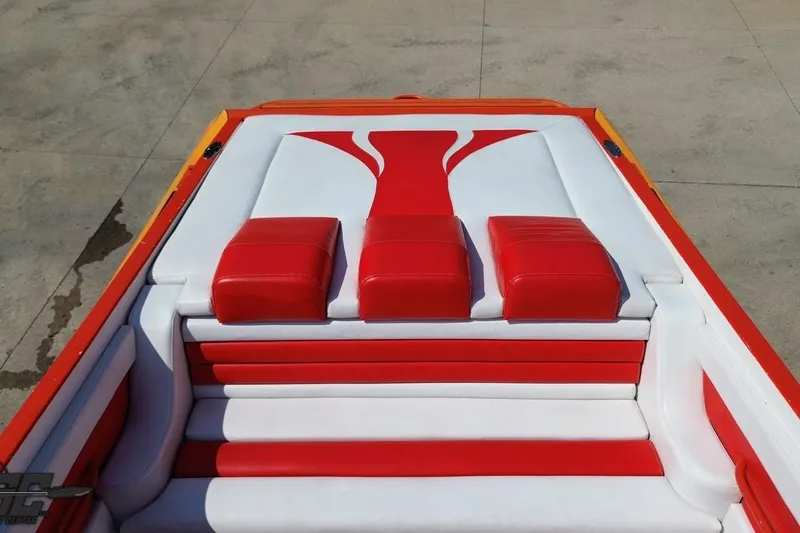 Slide: The Image of Red and white seating on 1995 Hustler 40 Fiore boat, showcasing sleek design. - 41