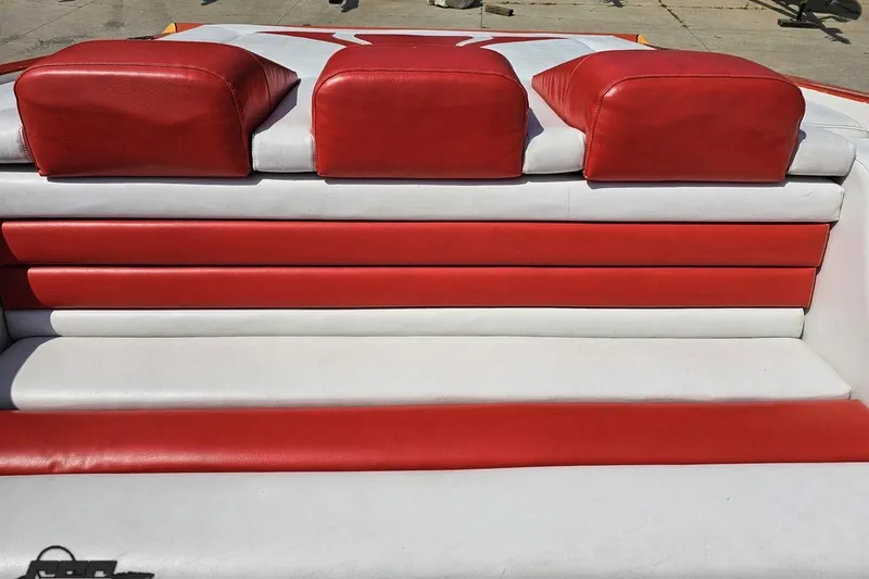 Slide: The Image of Red and white seating on 1995 Hustler 40 Fiore boat, showcasing sleek design. - 42