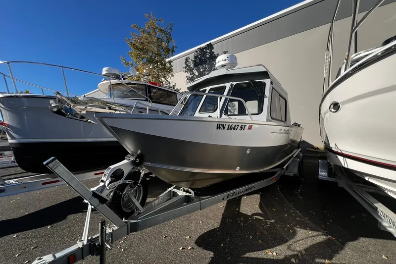 Slide: The Image of 2018 Hewescraft 220 Ocean Pro ET HT boat on trailer, parked outdoors. - 0