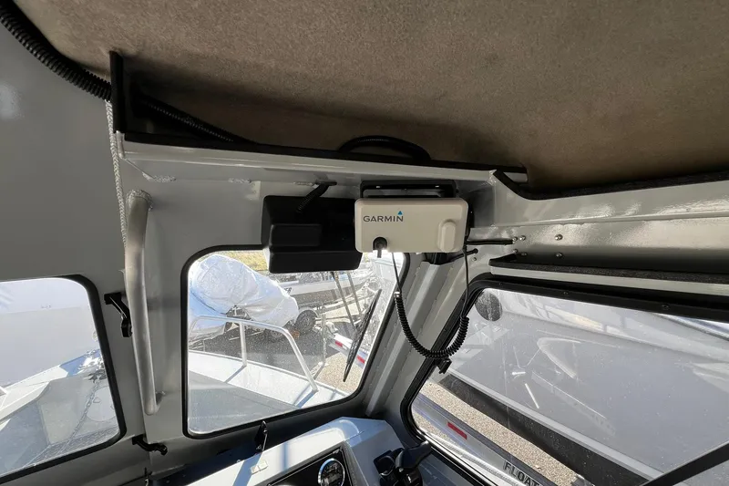 Slide: The Image of Interior view of 2018 Hewescraft 220 Ocean Pro ET HT with Garmin device installed. - 10