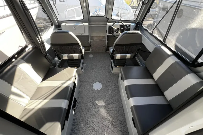 Slide: The Image of 2018 Hewescraft 220 Ocean Pro ET HT interior with seating and steering wheel. - 11