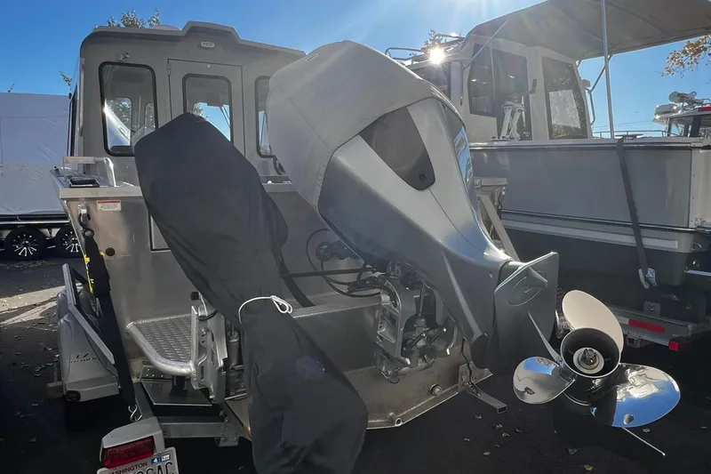 Slide: The Image of 2018 Hewescraft 220 Ocean Pro ET HT boat with outboard motor, parked on a trailer. - 12