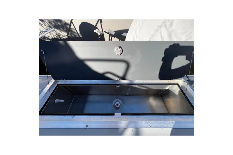 Slide: The Image of Open storage compartment on 2018 Hewescraft 220 Ocean Pro ET HT boat. - 16