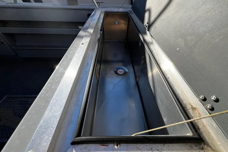 Slide: The Image of 2018 Hewescraft 220 Ocean Pro ET HT boat interior storage compartment. - 17