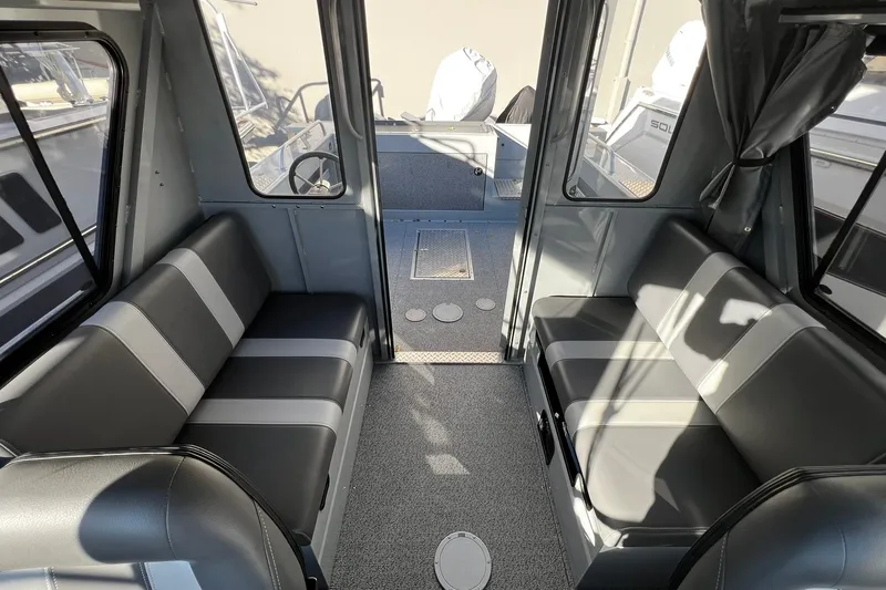 Slide: The Image of Interior of 2018 Hewescraft 220 Ocean Pro ET HT boat with gray seating and carpet. - 9