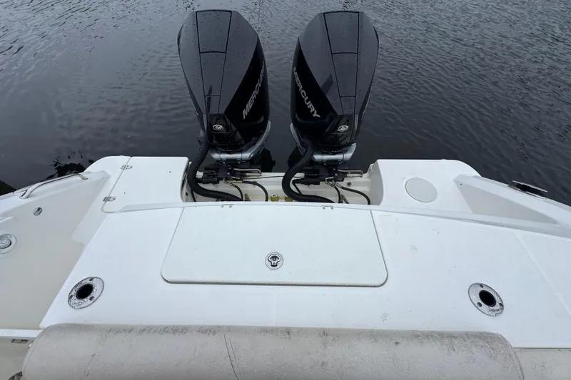 Slide: The Image of 2019 Boston Whaler 330 Outrage with dual Mercury outboard engines on water. - 16
