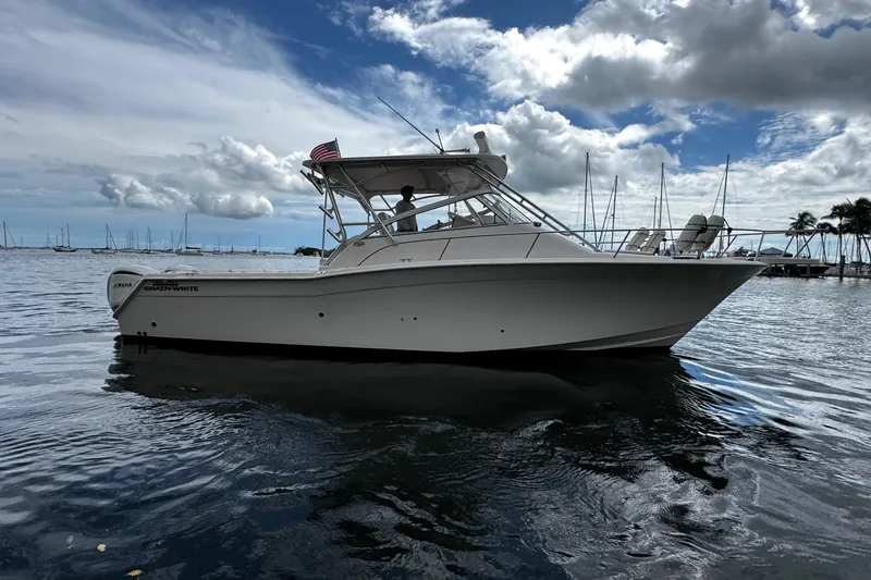 The Image of 2001 Grady-White Express 330 boat with twin Yamaha engines on a calm sea. - 0