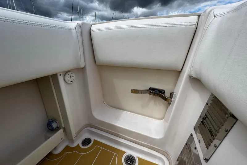 Slide: The Image of Interior view of a 2001 Grady-White Express 330 boat, featuring seating and storage. - 18
