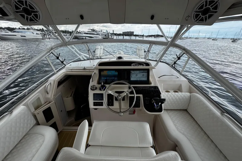 Slide: The Image of 2001 Grady-White Express 330 boat interior with steering wheel and navigation system. - 38