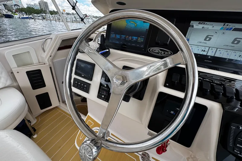 Slide: The Image of Helm of 2001 Grady-White Express 330 with modern navigation displays and controls. - 43