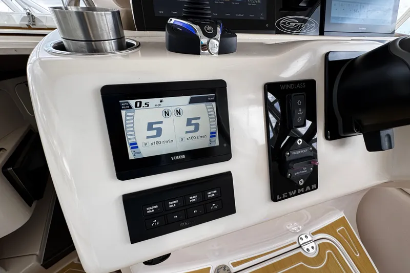 Slide: The Image of Control panel of a 2001 Grady-White Express 330 boat with Yamaha display. - 44