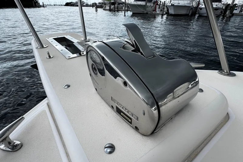 Slide: The Image of 2001 Grady-White Express 330 boat with a chrome anchor winch on deck. - 58