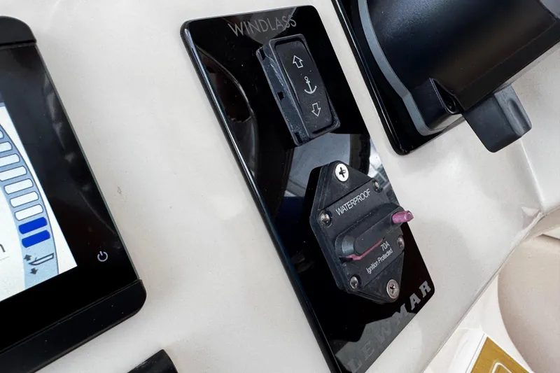 Slide: The Image of Control panel of 2001 Grady-White Express 330 boat with windlass and waterproof ignition switch. - 59