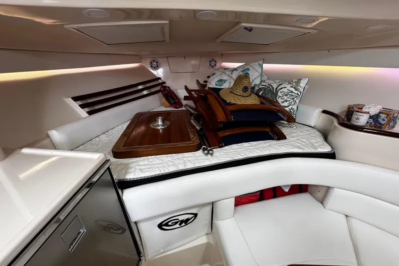 Slide: The Image of 2001 Grady-White Express 330 cabin interior with cushions and wooden accents. - 71