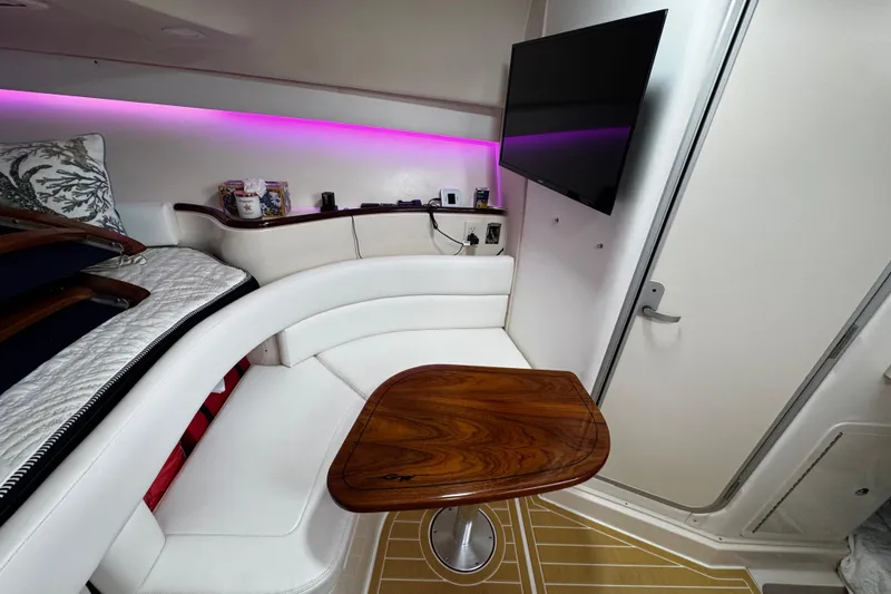 Slide: The Image of Interior of 2001 Grady-White Express 330 boat with seating, table, and TV. - 72