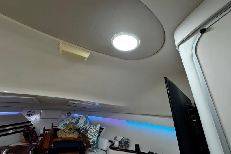 Slide: The Image of Interior of 2001 Grady-White Express 330 boat with modern lighting and decor. - 78