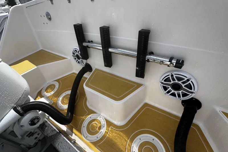 Slide: The Image of 2001 Grady-White Express 330 boat deck with speakers and rod holders. - 81