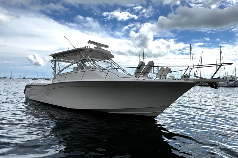 Slide: The Image of 2001 Grady-White Express 330 boat on calm water under cloudy sky. - 9