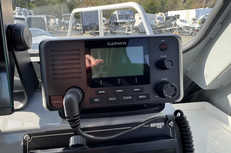 Slide: The Image of Garmin marine radio on 2023 Hewescraft 210 Sea Runner ET HT dashboard. - 15