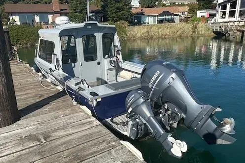 Slide: The Image of 2023 Hewescraft 210 Sea Runner ET HT dashboard with steering wheel and navigation equipment. - 3
