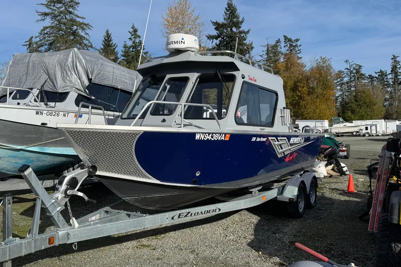 Slide: The Image of 2023 Hewescraft 210 Sea Runner ET HT boat on trailer in outdoor setting. - 8