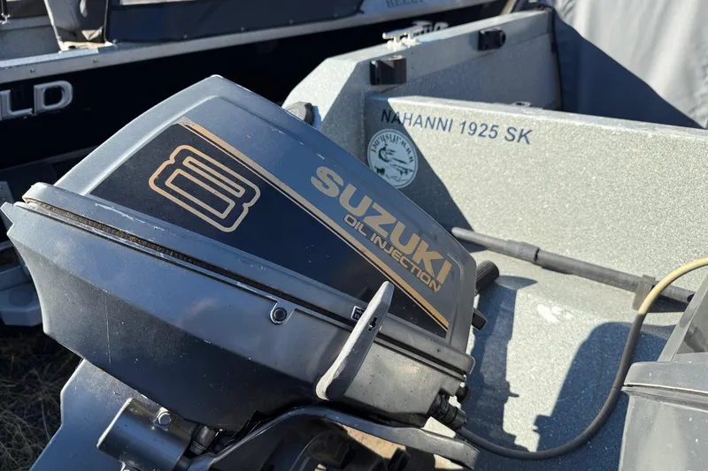 Slide: The Image of Suzuki oil injection engine on 2000 Harbor Craft Nahanni 1925 SK boat. - 12