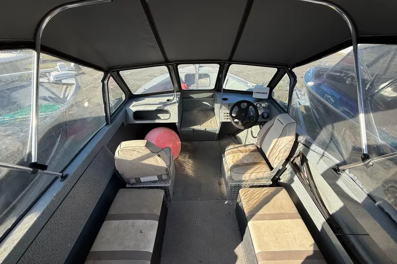 Slide: The Image of Interior of 2000 Harbor Craft Nahanni 1925 SK boat with seating and steering console. - 14