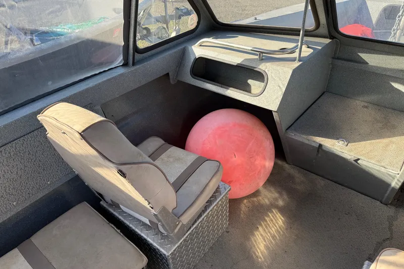 Slide: The Image of Interior of 2000 Harbor Craft Nahanni 1925 SK boat with seat and red buoy. - 15