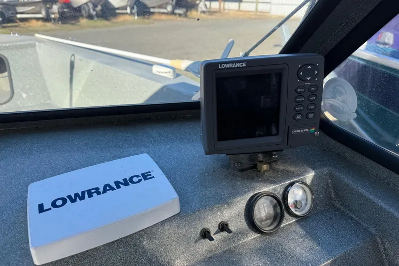 Slide: The Image of Lowrance navigation system on 2000 Harbor Craft Nahanni 1925 SK boat dashboard. - 19