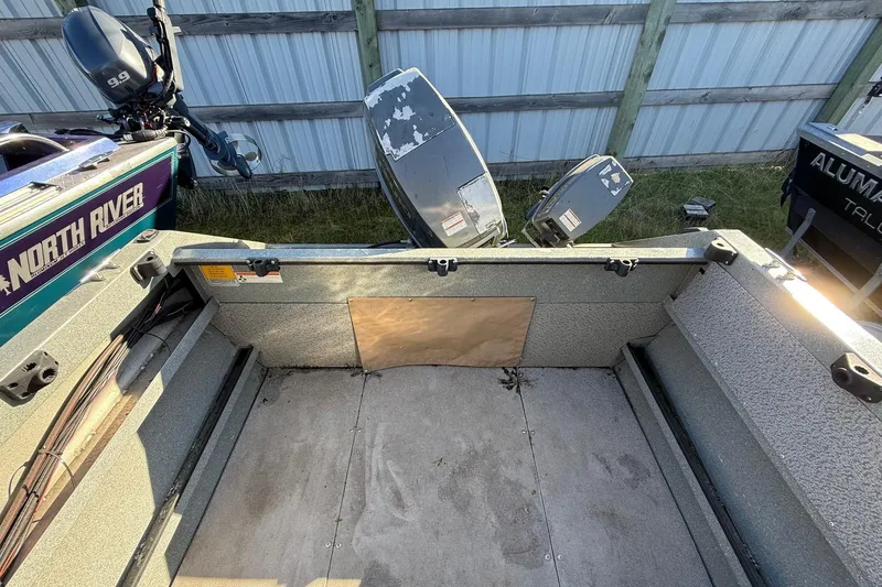 Slide: The Image of Interior view of a 2000 Harbor Craft Nahanni 1925 SK boat with outboard motor. - 23