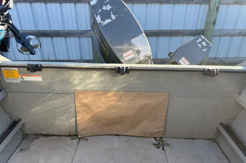 Slide: The Image of Interior view of a 2000 Harbor Craft Nahanni 1925 SK boat with visible motor. - 27