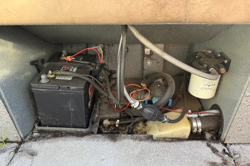 Slide: The Image of Battery and wiring inside a 2000 Harbor Craft Nahanni 1925 SK boat compartment. - 28