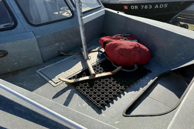 Slide: The Image of Harbor Craft Nahanni 1925 SK boat interior with anchor and red bag, 2000 model. - 7