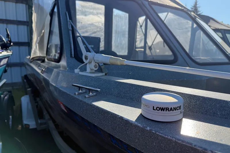 Slide: The Image of Harbor Craft Nahanni 1925 SK boat with Lowrance equipment, 2000 model, docked in sunlight. - 8