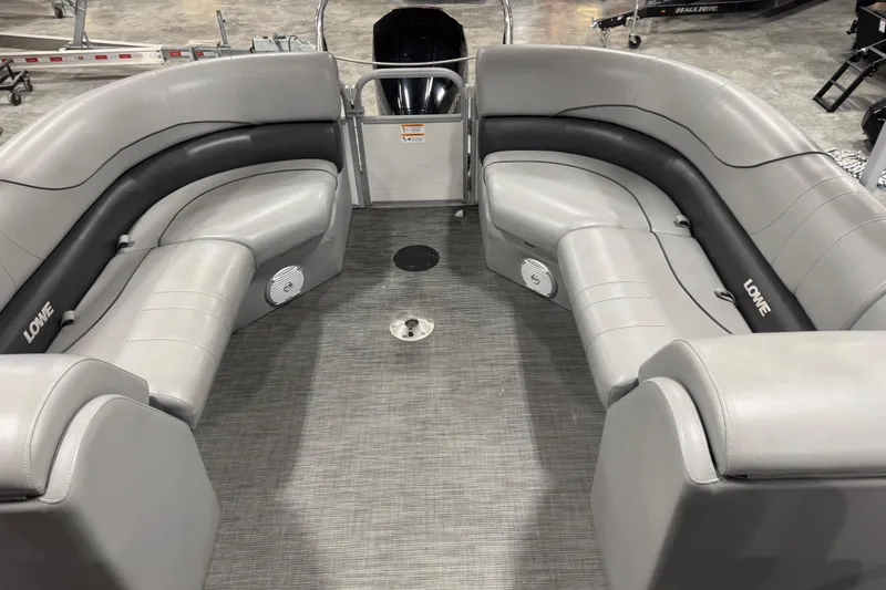 Slide: The Image of 2021 Lowe SS 270 boat interior with gray seating and carpeted floor. - 11