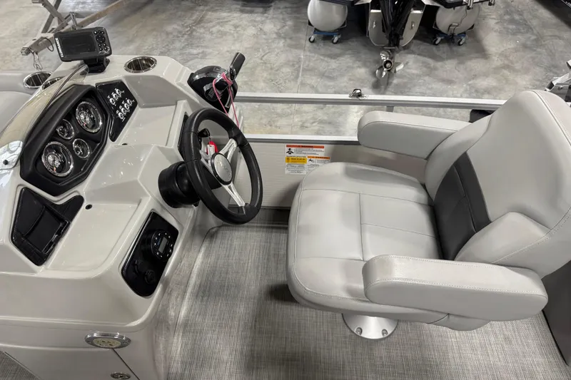 Slide: The Image of 2021 Lowe SS 270 boat cockpit with steering wheel and captain's chair. - 9