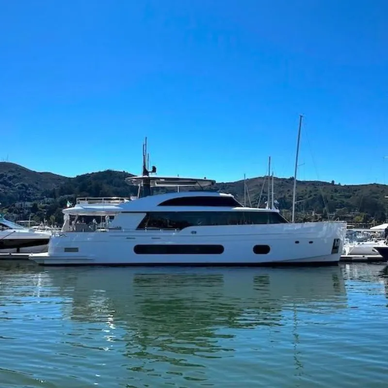 The Image of Luxury Azimut Grande Magellano 25 Metri yacht cruising under a bridge, 2026 model. - 0