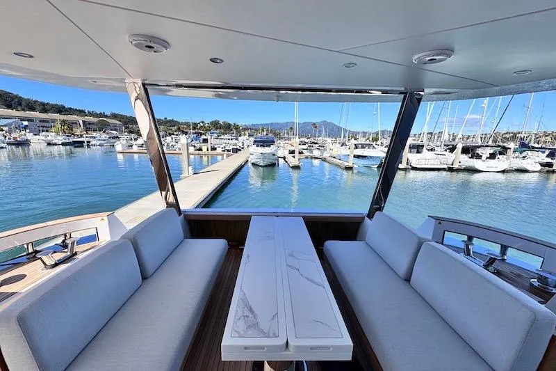 Slide: The Image of Luxurious deck of 2026 Azimut Grande Magellano 25 Metri yacht with seating and spiral staircase. - 10