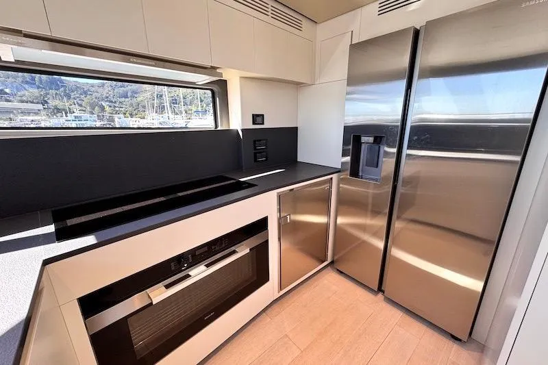 Slide: The Image of Modern kitchen interior of 2026 Azimut Grande Magellano 25 Metri yacht, featuring sleek design. - 19