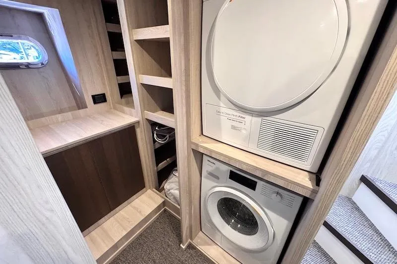 Slide: The Image of Luxurious bathroom in 2026 Azimut Grande Magellano 25 Metri yacht, featuring modern sink and porthole. - 22