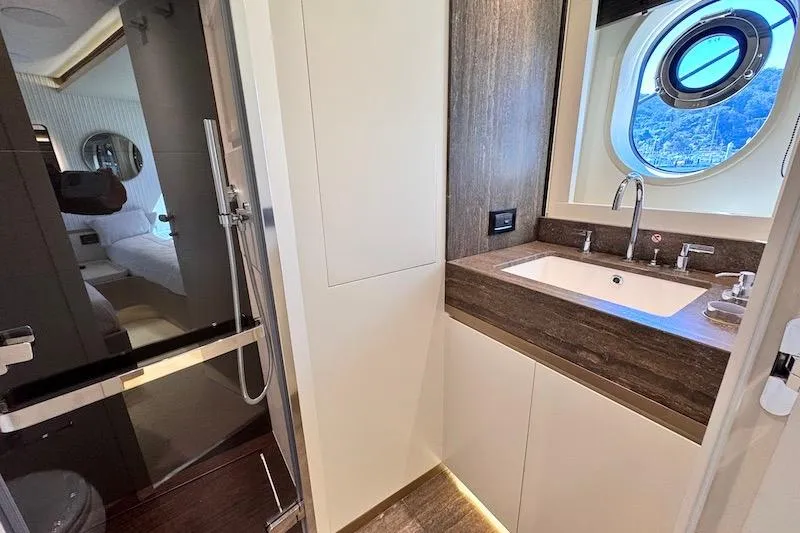 Slide: The Image of Luxurious cabin interior of 2026 Azimut Grande Magellano 25 Metri yacht with porthole view. - 61