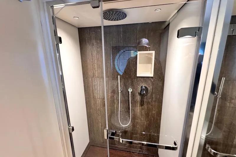 Slide: The Image of Luxurious bathroom in 2026 Azimut Grande Magellano 25 Metri yacht with dual sinks and porthole view. - 69