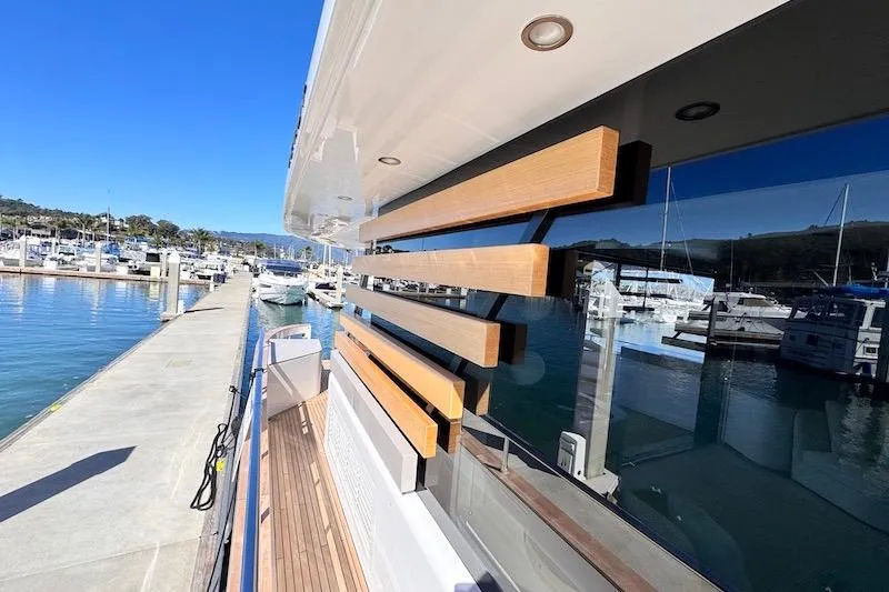 Slide: The Image of 2026 Azimut Grande Magellano 25 Metri yacht docked at a marina under clear blue skies. - 7