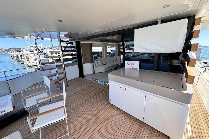 Slide: The Image of Luxurious 2026 Azimut Grande Magellano 25 Metri yacht deck with elegant seating and marina view. - 9